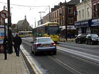 Trams mix with cars on Union Street Oldham as 3009 heads for Rochdale next stop Oldham Central.  Photo R Clarke